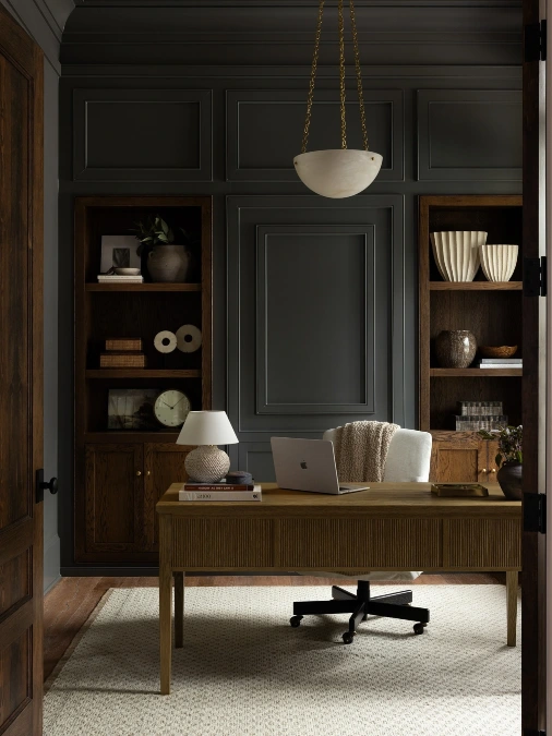 Dark Paneled Room with Fluted Desk