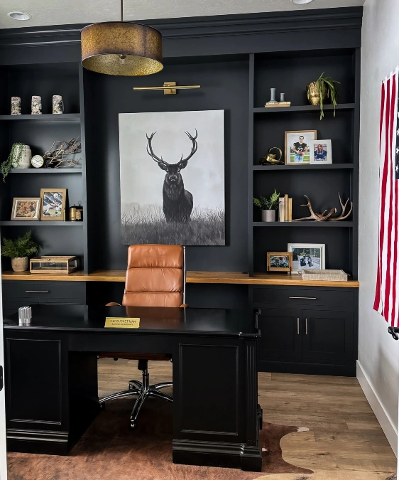 Moody Black Built-ins and Stag Artwork