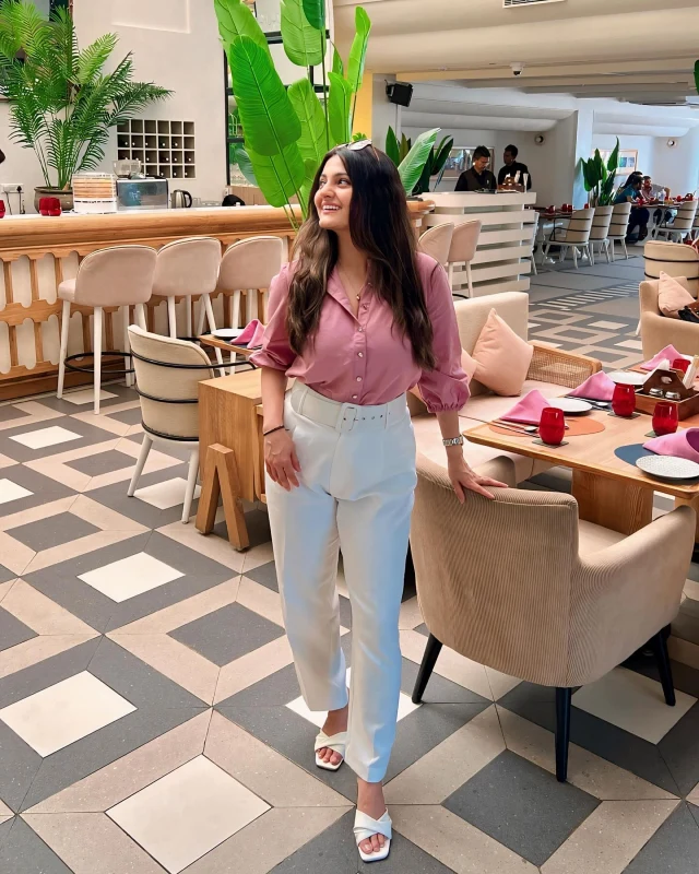 Mauve Blouse and Belted White Trousers