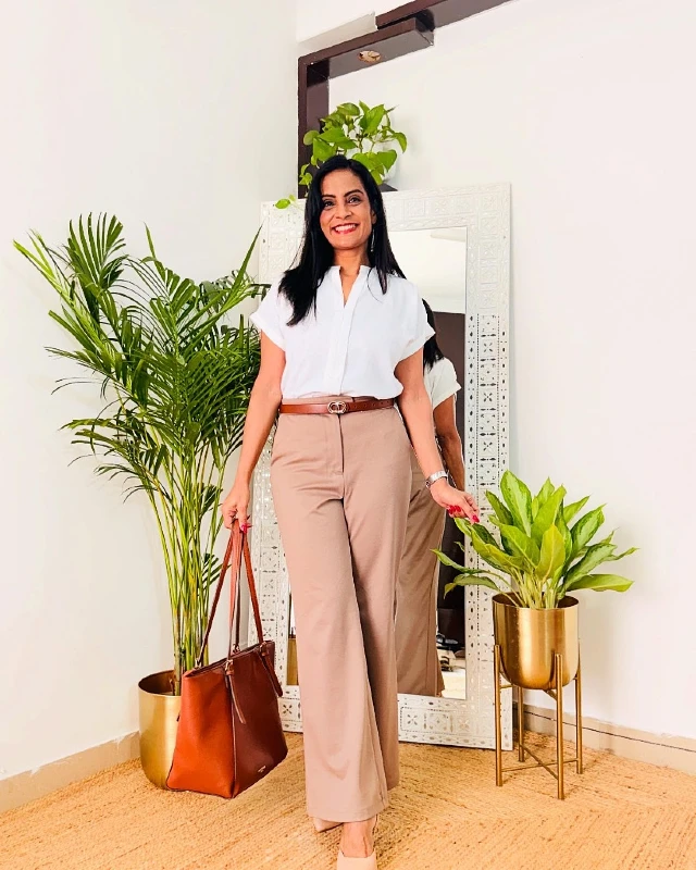 White V-Neck Blouse and Tan Trousers