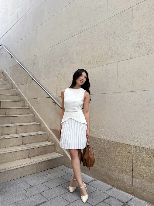 White Sleeveless Top With Pleated Skirt