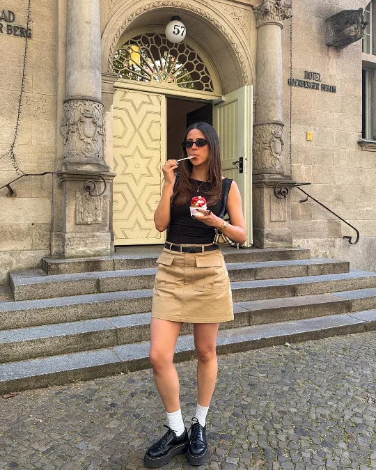 Black Sleeveless Top With Beige Mini Skirt